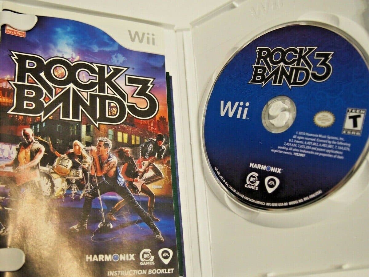 A retail copy of Rock Band 3 for the Wii — manual and disc